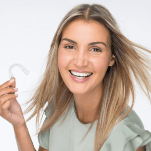 a lady smiling with invisalign clear aligner