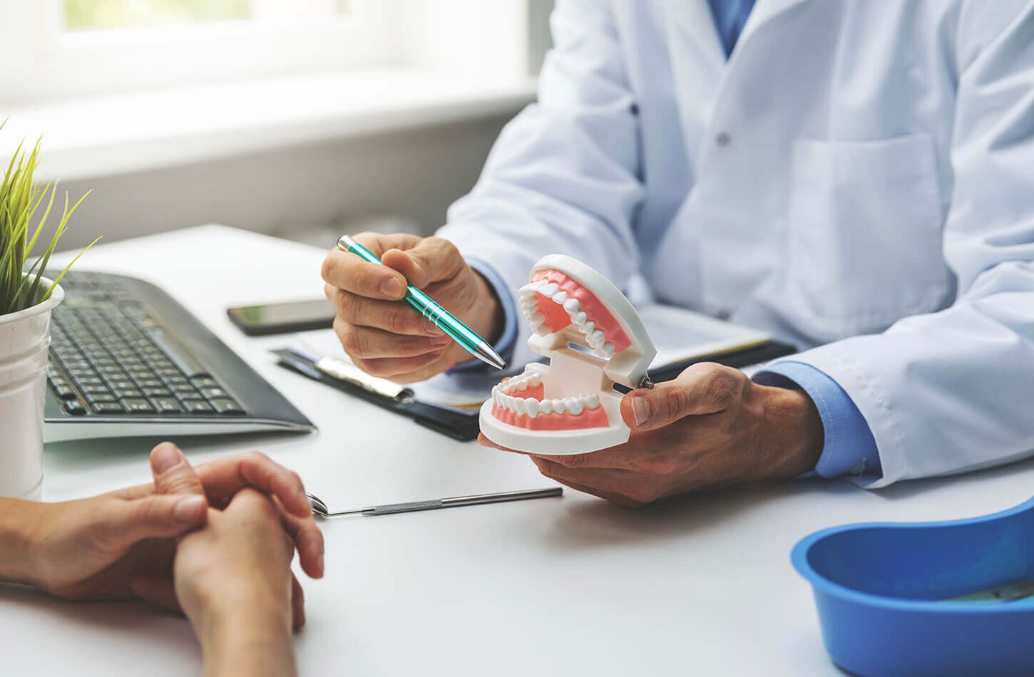 A customer at DermaMedica during a consultation for composite bonding veneers