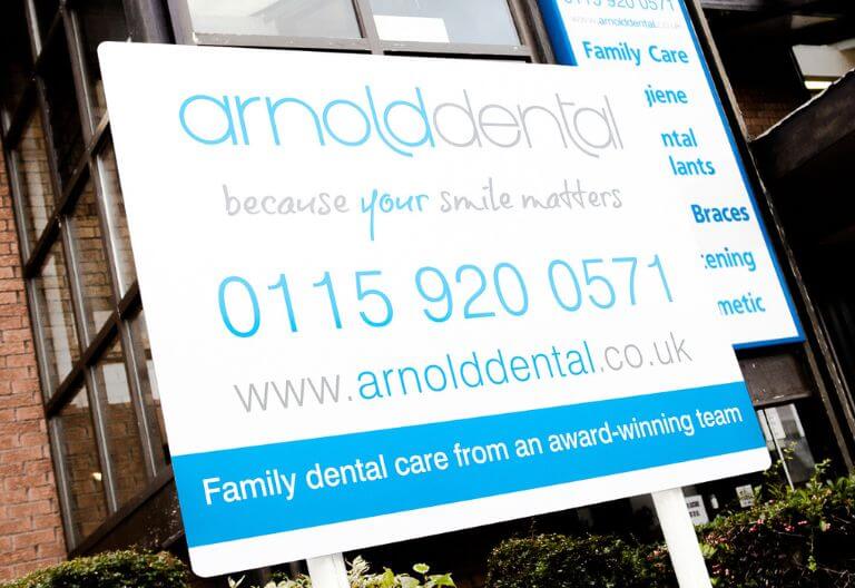 a sign of the Arnold Dental Sign 