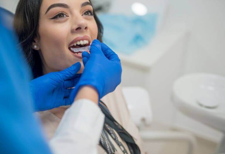 a woman getting Invisalign implemented