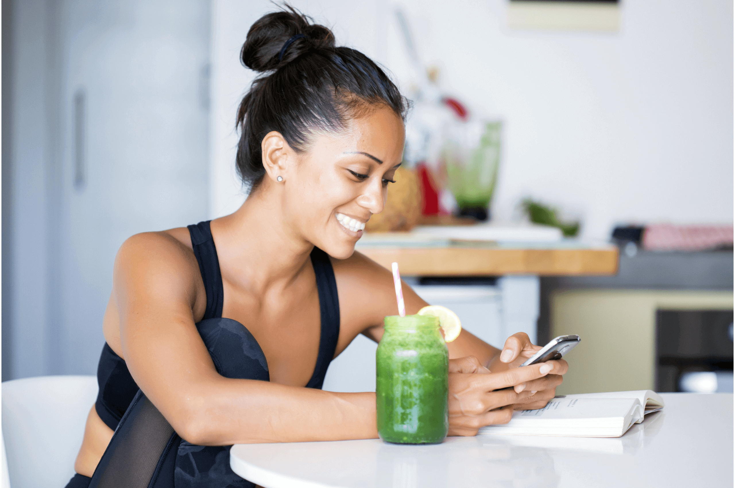 woman on her phone showing off smile while on her phone