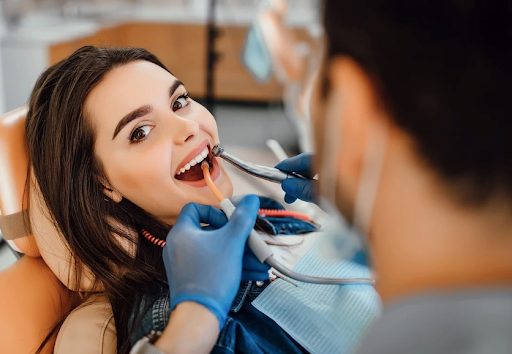 A person getting a dental implant for the bottom teeth at Arnold Dental & Implant Centre.